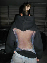 BackStageGlow | Wanneer de lichten aangaan, schittert deze hoodie niet alleen, maar domineert hij de ruimte