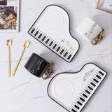 Pianissimo smaak – elegante set van een kopje en een dienblad voor muziekliefhebbers