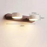 Moderne LED wandlamp met draaibare kappen van steen en een houten basis