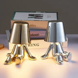 Designer LED tafellamp zittende man met glanzende afwerking