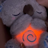 Kalmerende Koala Ademhalingsspeelgoed | Ritmische Ademhalingssimulator | Tactiele Haptische Hartslag & Ultrasone Geluidstherapie | Geïntegreerde LED Nachtlamp | Slaapverwekkende Gewogen Pluche Companion