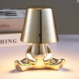 Designer LED tafellamp zittende man met glanzende afwerking