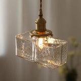 Vintage hanglampen van glas met messing afwerking