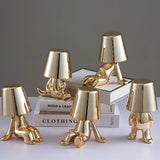 Designer LED tafellamp zittende man met glanzende afwerking