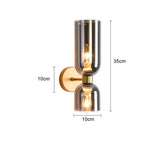 Elegante wandlamp met rookglas en gouden afwerking – dubbele lichtbron