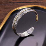 Vogel | Vintage-geïnspireerde verenarmband in edgy punkstijl
