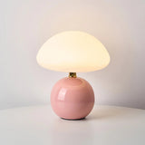 Moderne tafellamp met een bolvormige voet en een paddenstoelvormige kap – minimalistische stijl